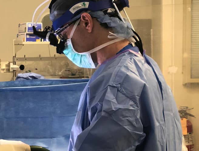 Surgeon performing a cervical spine procedure