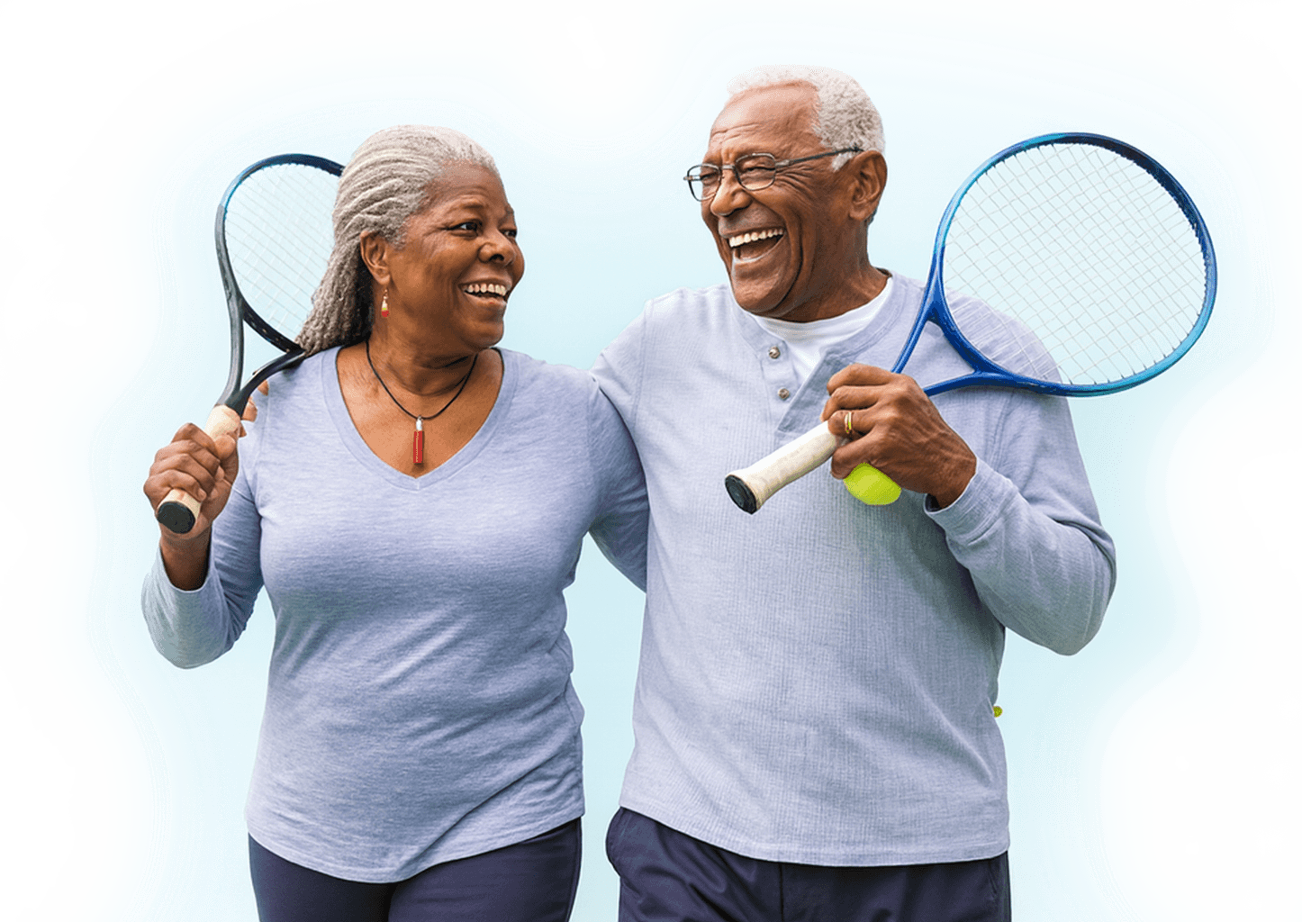 Happy couple playing tennis